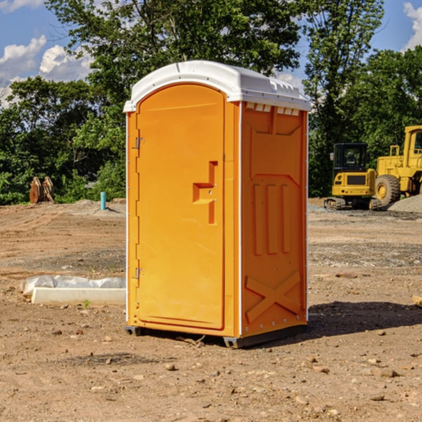 what is the cost difference between standard and deluxe portable restroom rentals in Harmon